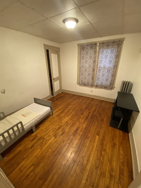 9 Fifth Avenue Worcester, MA 01607 - Photo 14 of 41 a view of a room with wooden floor and chair