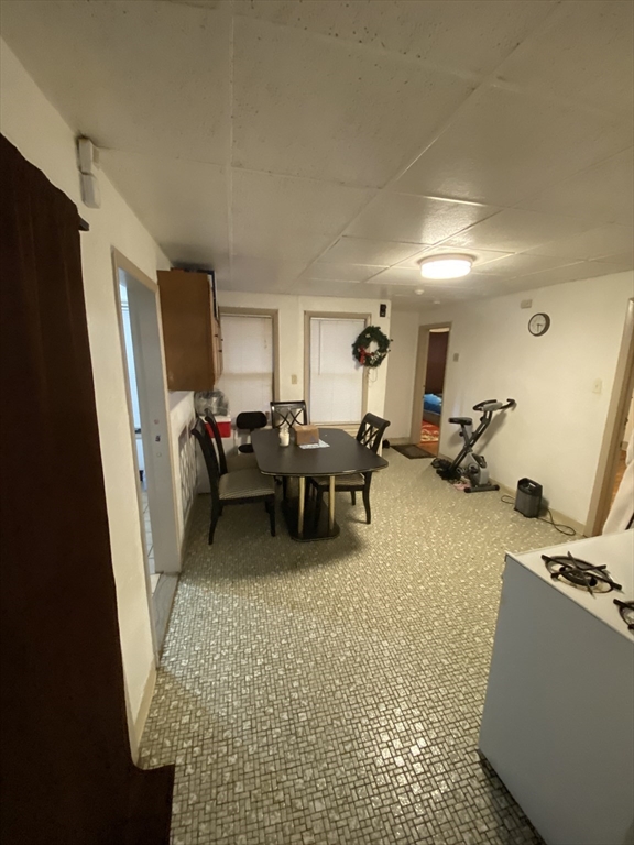 9 Fifth Avenue Worcester, MA 01607 - Photo 15 of 41 a living room with furniture a large window and gym equipment