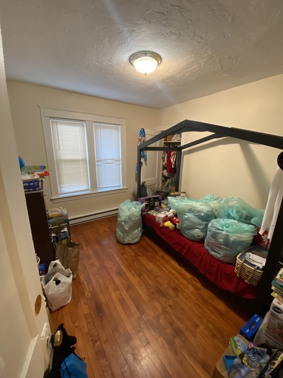 9 Fifth Avenue Worcester, MA 01607 - Photo 16 of 41 a bedroom with furniture and a window
