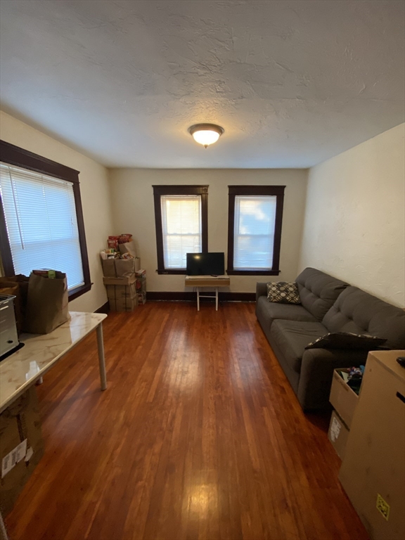 9 Fifth Avenue Worcester, MA 01607 - Photo 20 of 41 a living room with furniture and a wooden floor