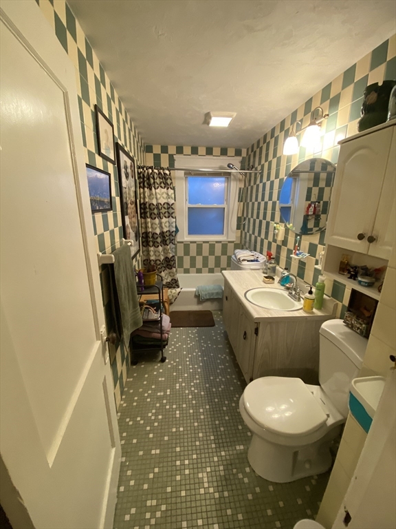 9 Fifth Avenue Worcester, MA 01607 - Photo 25 of 41 a bathroom with toilet sink and mirror