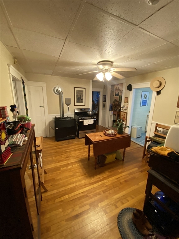 9 Fifth Avenue Worcester, MA 01607 - Photo 29 of 41 a living room with furniture a flat screen tv and a stove