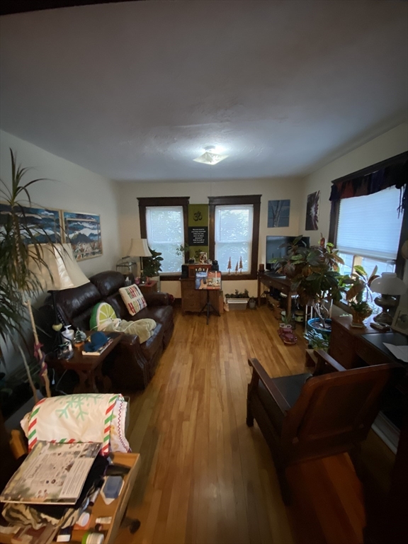 9 Fifth Avenue Worcester, MA 01607 - Photo 31 of 41 a living room with furniture and a wooden floor