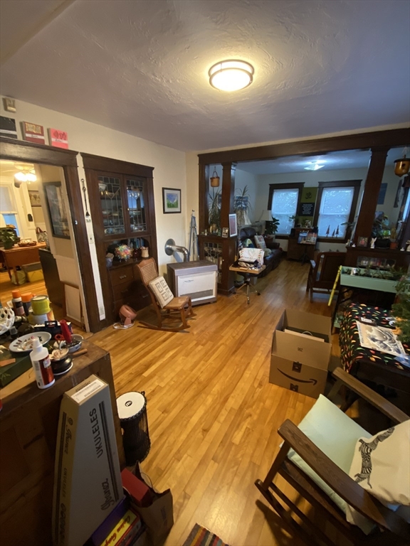 9 Fifth Avenue Worcester, MA 01607 - Photo 32 of 41 a living room with furniture a flat screen tv and a fireplace