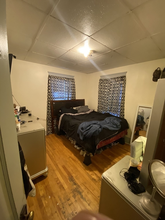 9 Fifth Avenue Worcester, MA 01607 - Photo 34 of 41 a bed sitting in a bedroom next to a window