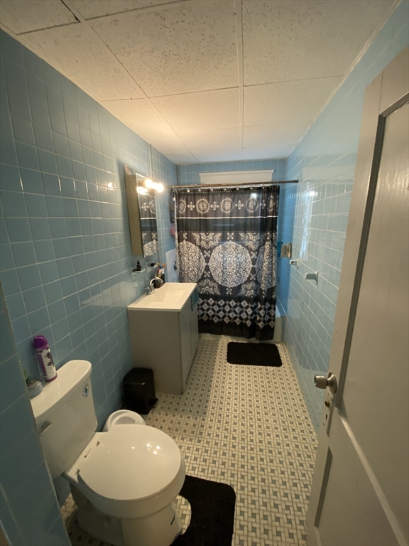 9 Fifth Avenue Worcester, MA 01607 - Photo 36 of 41 a bathroom with a sink and a mirror