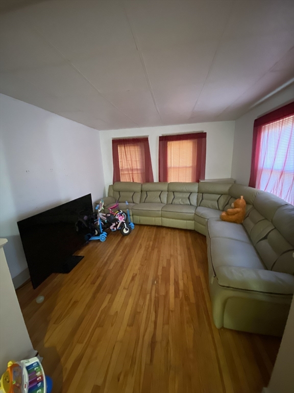 9 Fifth Avenue Worcester, MA 01607 - Photo 10 of 41 a living room with furniture and a flat screen tv