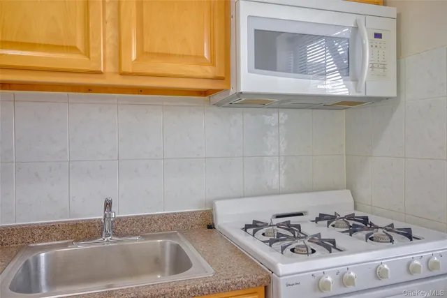 a bathroom with a sink and a stove
