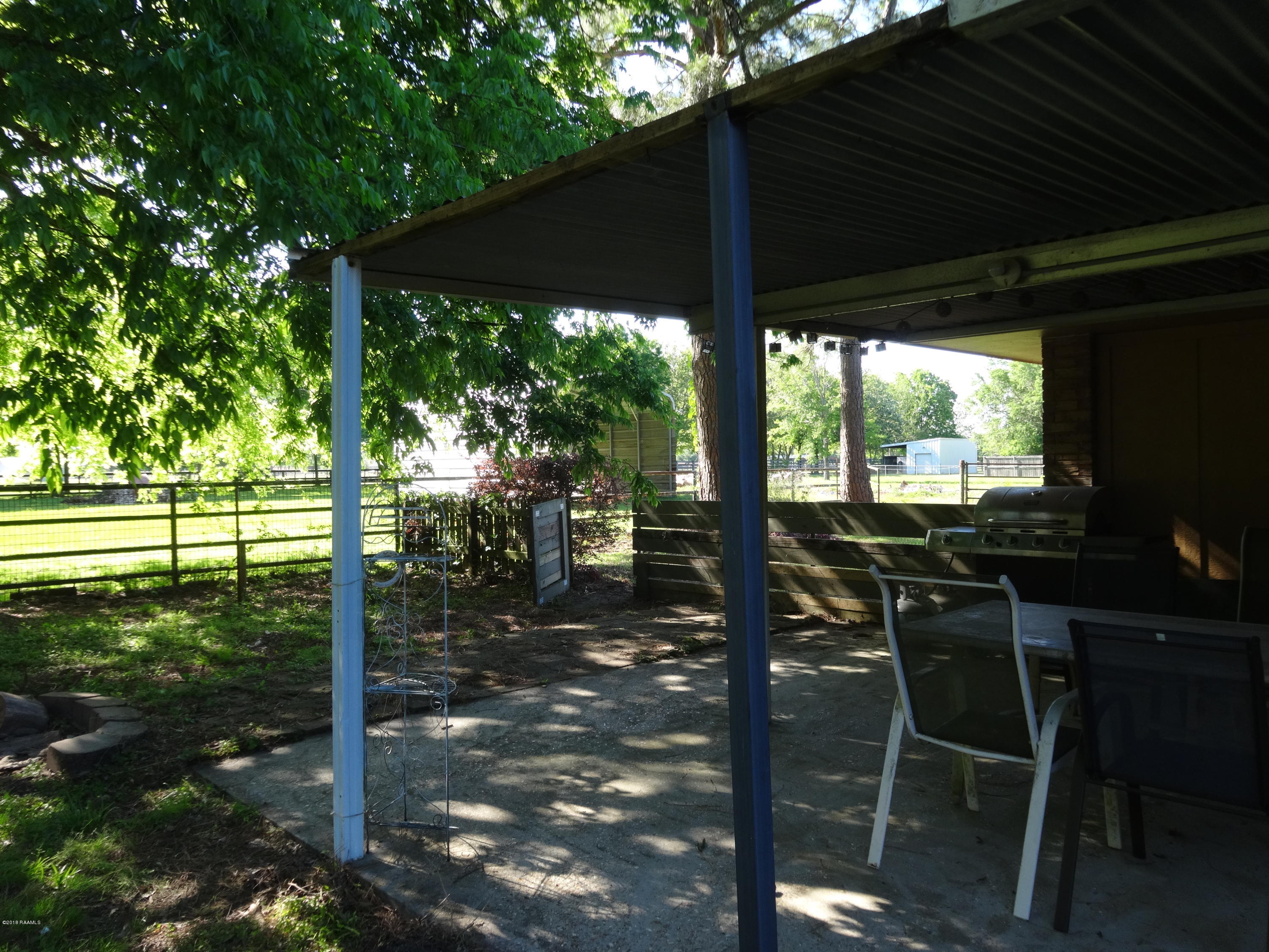177 Atlas Road Youngsville, LA 70592 - Photo 29 of 33 Backyard view with open covered patio