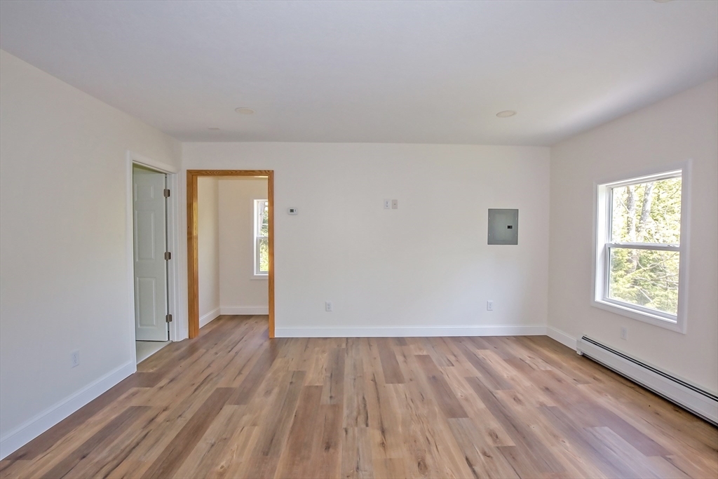 165 Sandisfield Road Sandisfield, MA 01255 - Photo 33 of 37 wooden floor in an empty room with a window