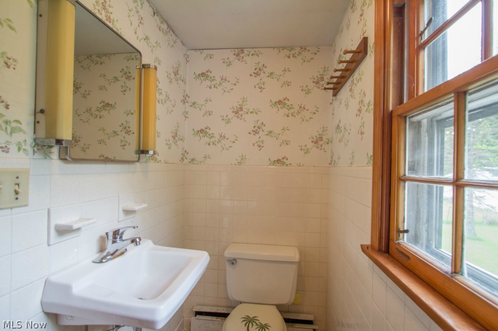 5892 Taylor Road Painesville, OH 44077 - Photo 21 of 25 This half bath is located on the second floor.