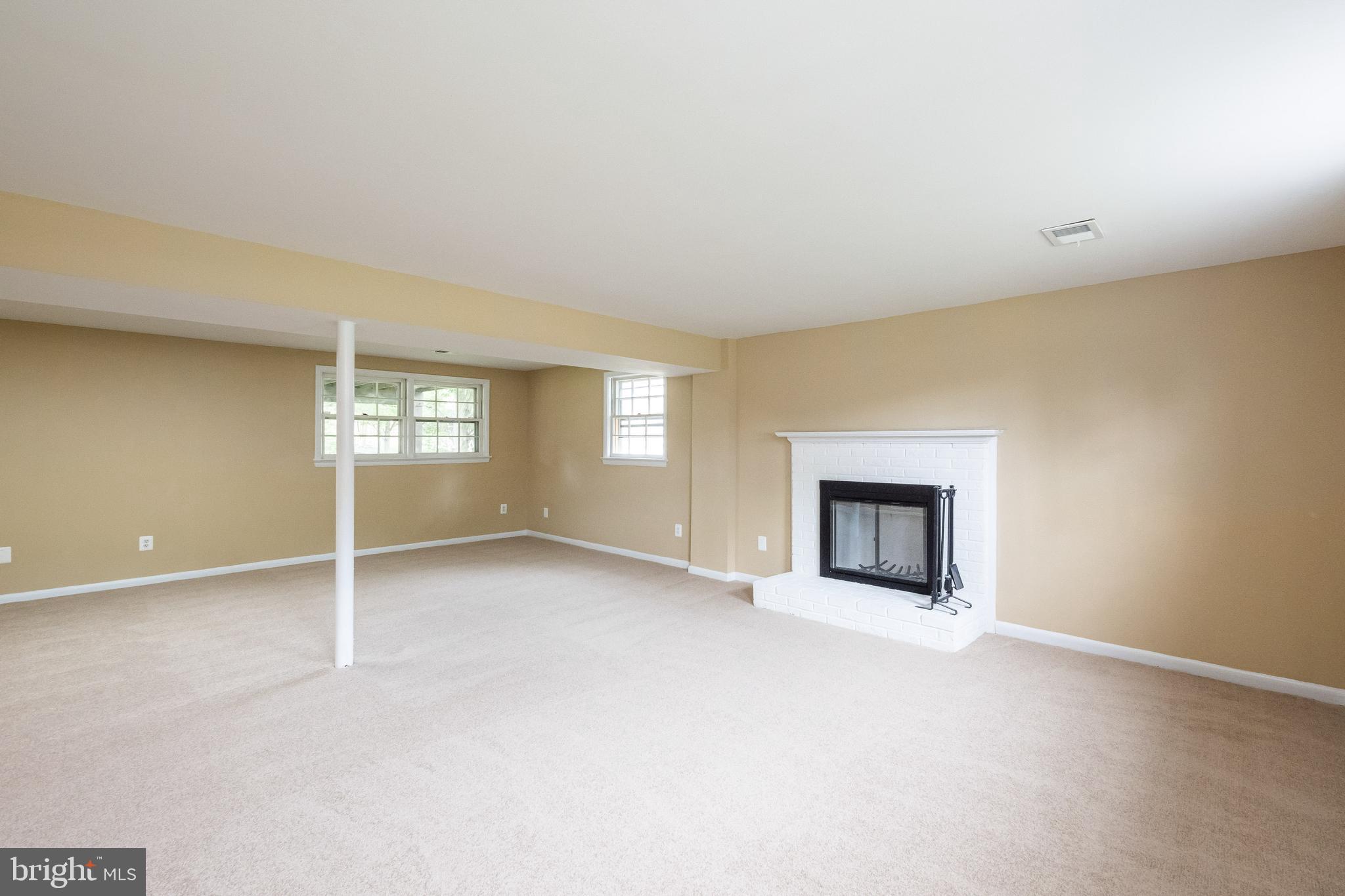 7802 Hayfield Road Alexandria, VA 22315 - Photo 20 of 34 Cozy Rec Rm w Fireplace