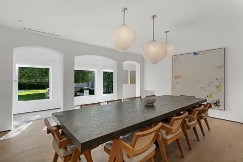 a view of a dining room with furniture and window