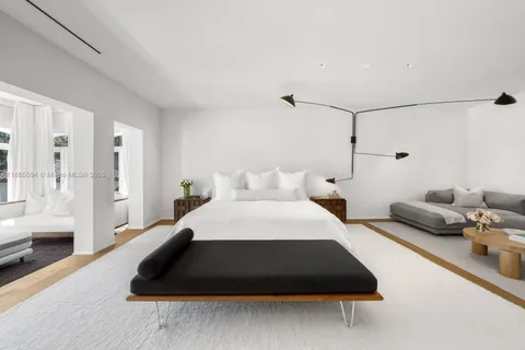 a bedroom with a bed and a couch