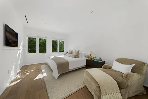 a bedroom with bed and tv