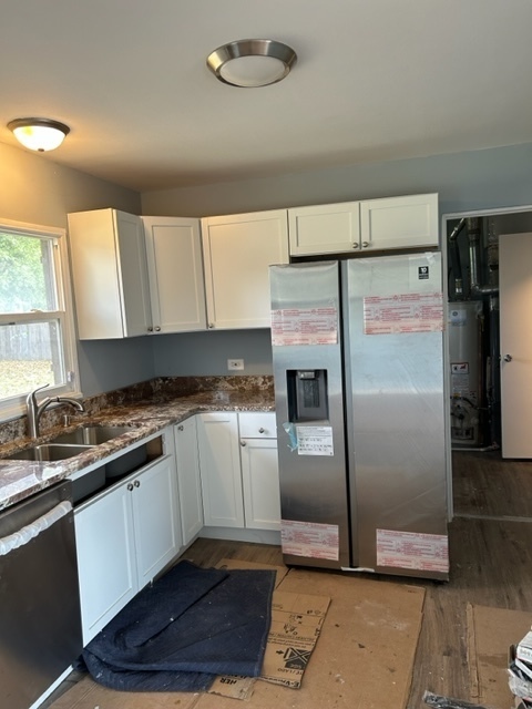 200 Flagstaff Lane Hoffman Estates, IL 60169 - Photo 5 of 19 a kitchen with granite countertop a refrigerator and a sink