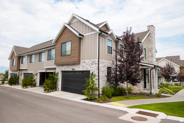 1404 East Rustic Wood Court Sandy, UT 84092 - Photo 31 of 33 Contemporary townhome exterior featuring stone accents and vertical siding