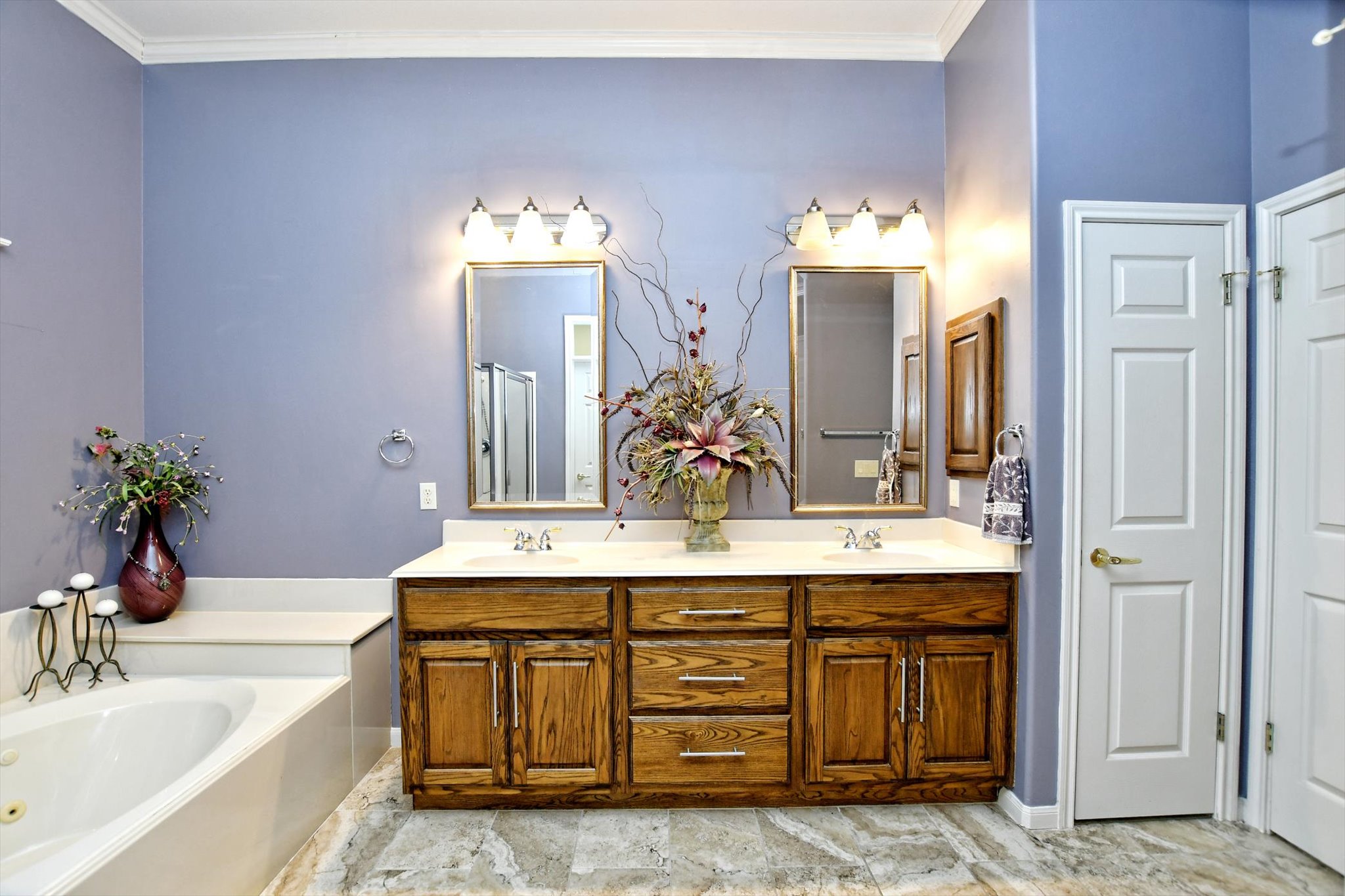 106 Nighthawk Way Georgetown, TX 78633 - Photo 17 of 29 Double vanities and a soaking tub create a luxurious and functional bathroom retreat.