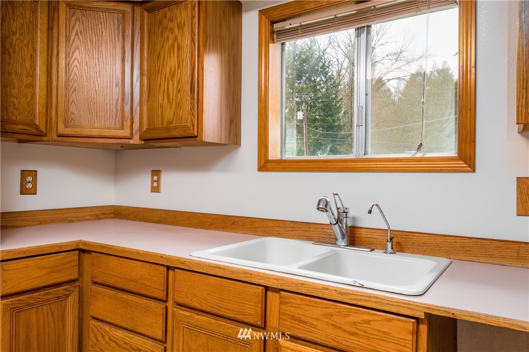 1320 Coal Creek Road Longview, WA 98632 - Photo 11 of 34 a kitchen with a sink and cabinets