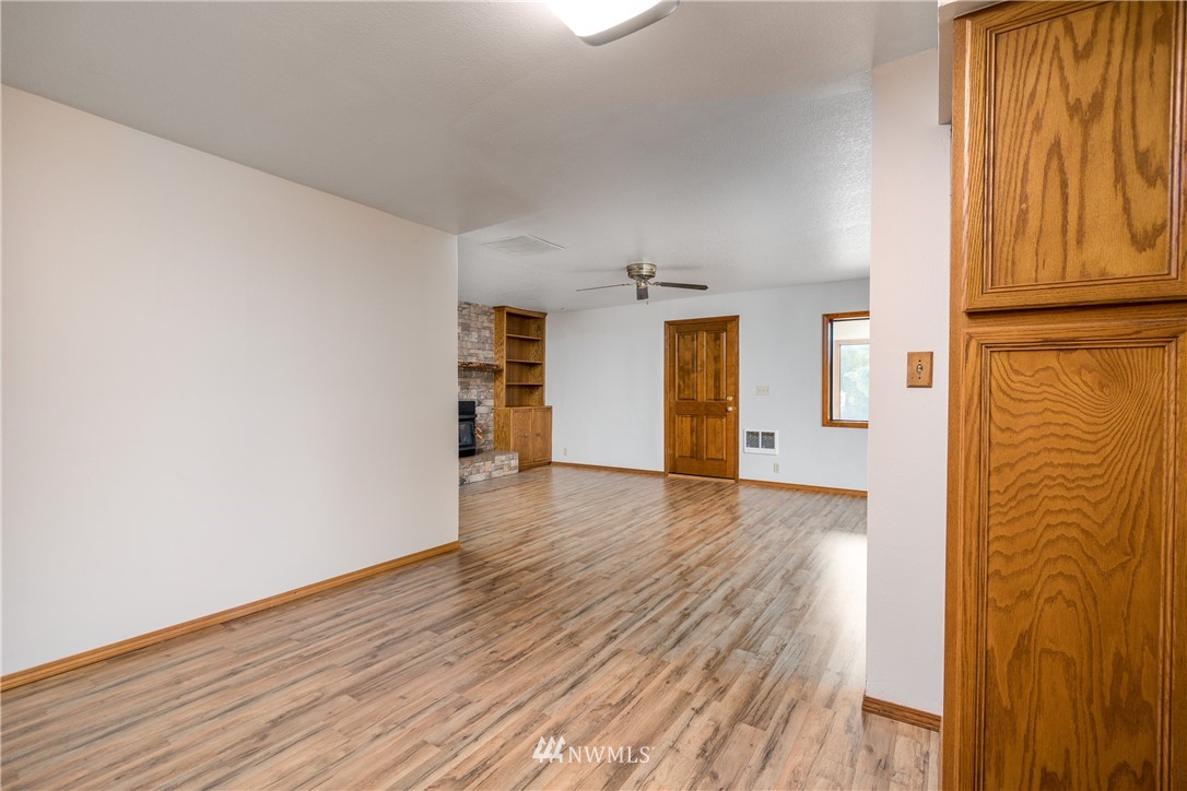 1320 Coal Creek Road Longview, WA 98632 - Photo 13 of 34 a view of empty room with wooden floor and fan