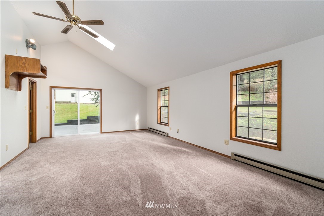 1320 Coal Creek Road Longview, WA 98632 - Photo 19 of 34 an empty room with windows and ceiling fan
