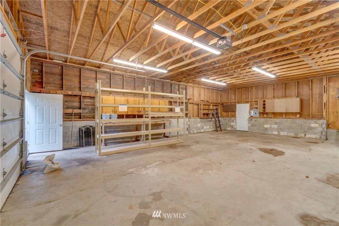 1320 Coal Creek Road Longview, WA 98632 - Photo 26 of 34 a view of a garage with wooden ceiling