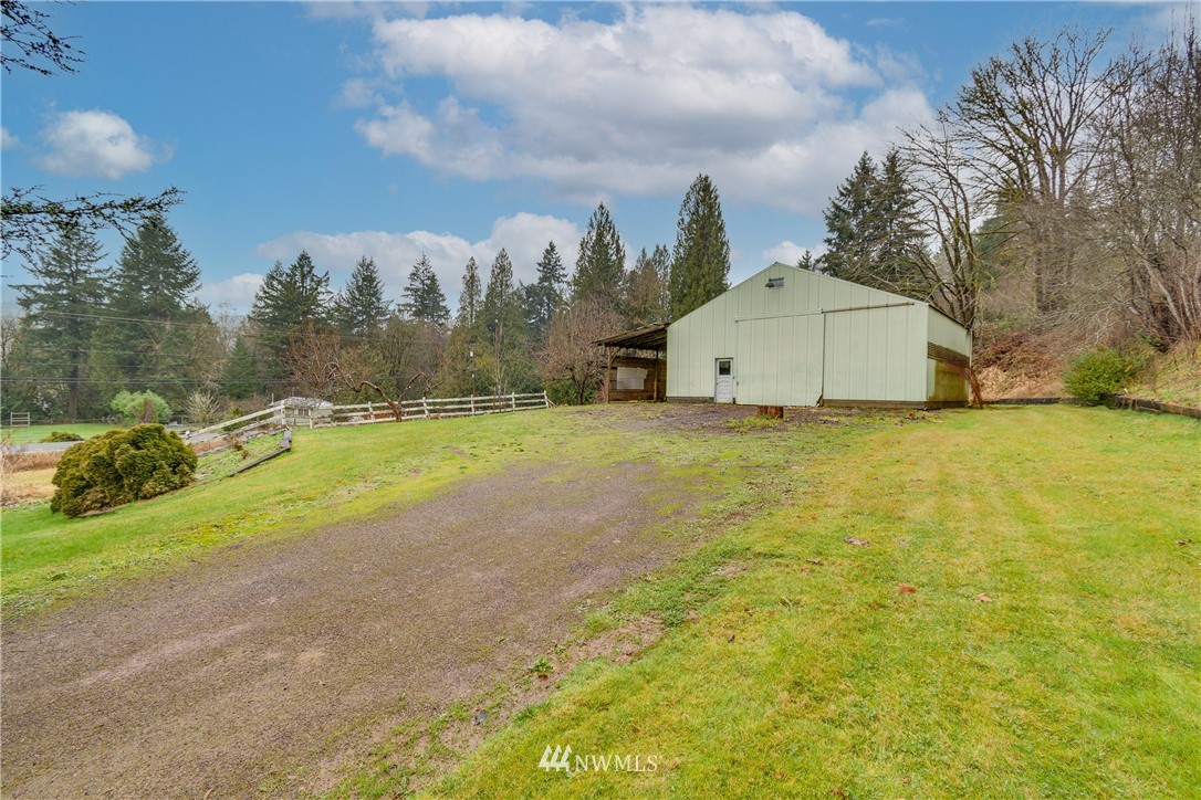 1320 Coal Creek Road Longview, WA 98632 - Photo 28 of 34 a view of a house with a yard and garage