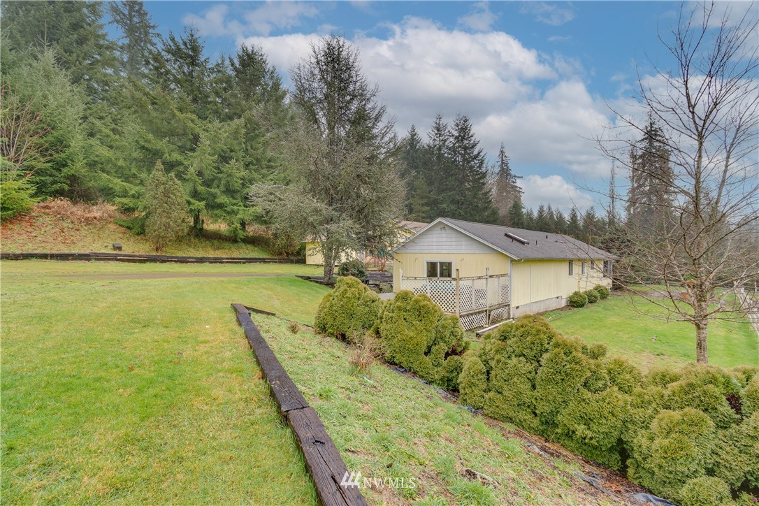1320 Coal Creek Road Longview, WA 98632 - Photo 5 of 34 a view of a house with a yard and lake view