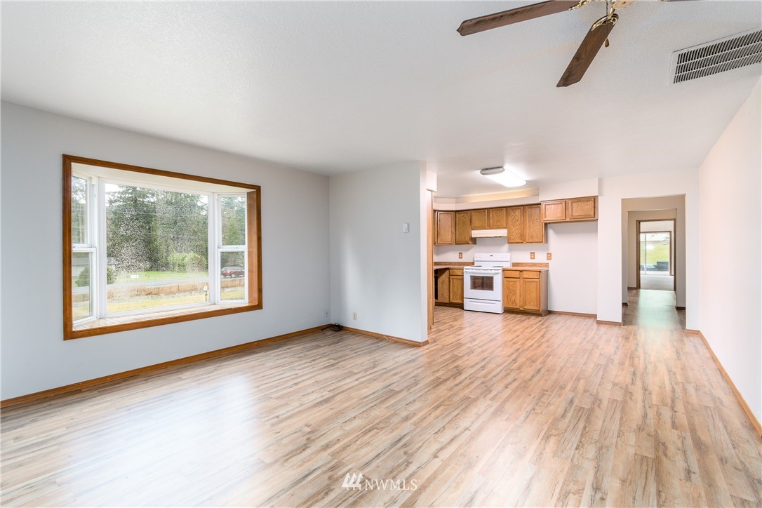 1320 Coal Creek Road Longview, WA 98632 - Photo 7 of 34 a view of a big room with wooden floor and windows