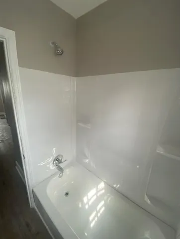 a bathroom with a sink and mirror