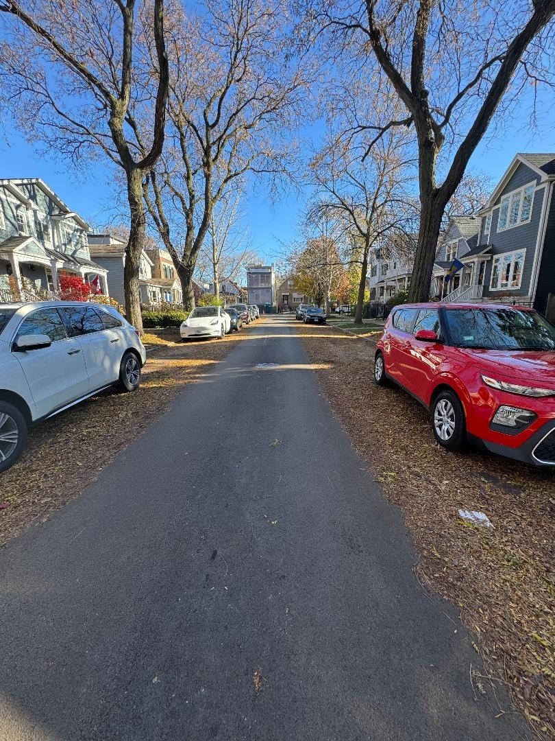 1831 West Nelson Street, Unit 1 Chicago, IL 60657 - Photo 9 of 11 a view of street with parked cars