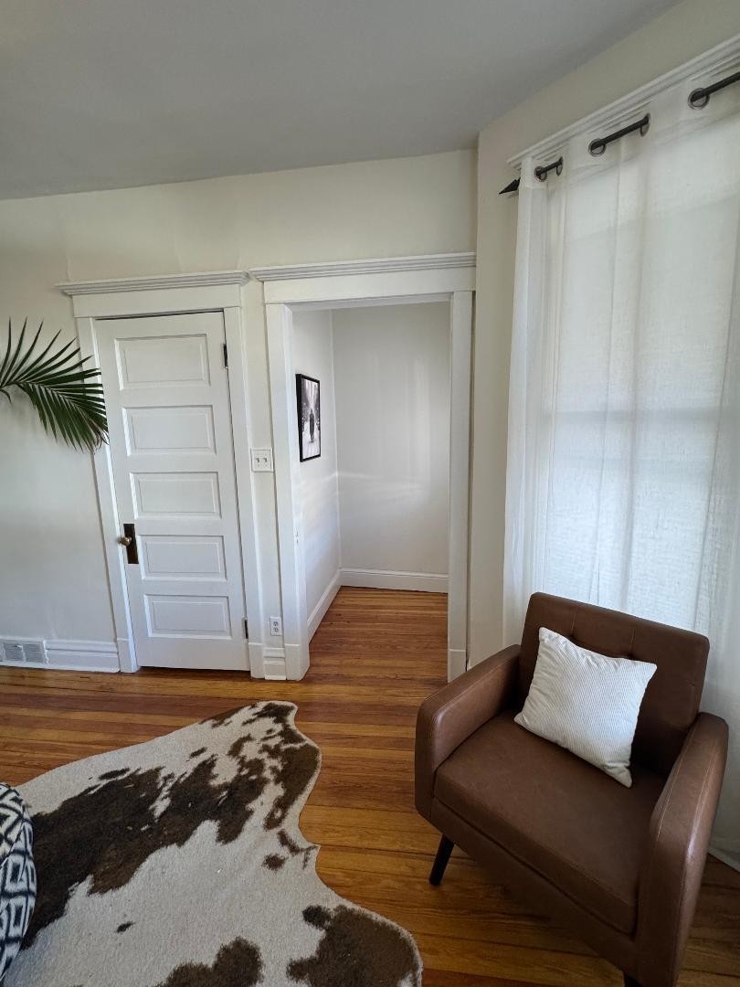 1831 West Nelson Street, Unit 1 Chicago, IL 60657 - Photo 10 of 11 a bedroom with a bed and a walk in closet