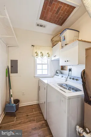 a kitchen with a sink appliances and cabinets