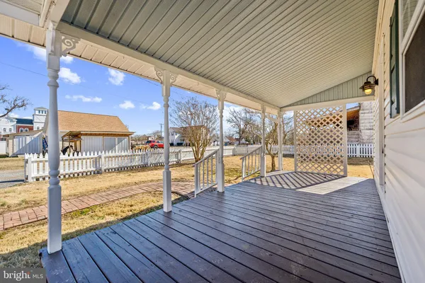a view of a balcony with wooden floor