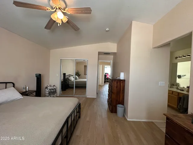 a view of livingroom with hardwood floor and ceiling fan