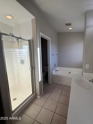 a kitchen with stainless steel appliances granite countertop a stove a sink dishwasher and a refrigerator