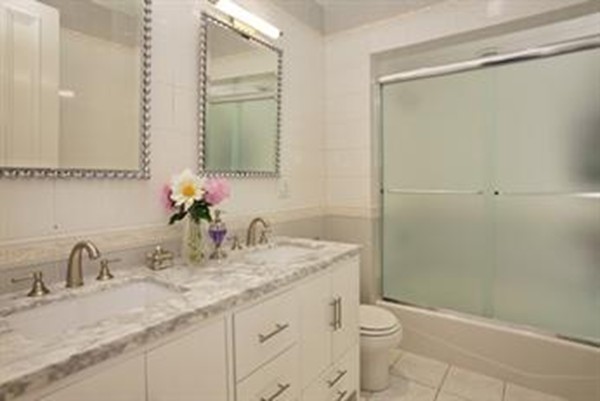 365 Beacon Street, Unit 2 Boston, MA 02116 - Photo 6 of 15 a bathroom with a granite countertop sink toilet and shower
