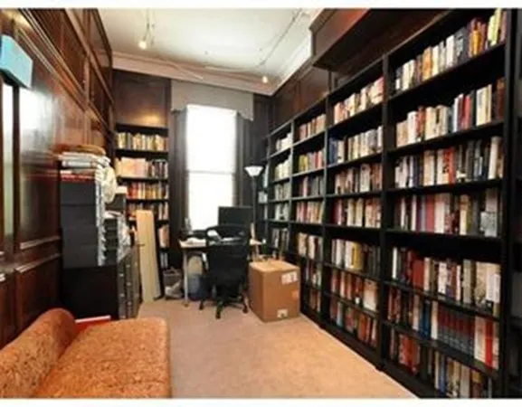 a workspace with furniture in a room