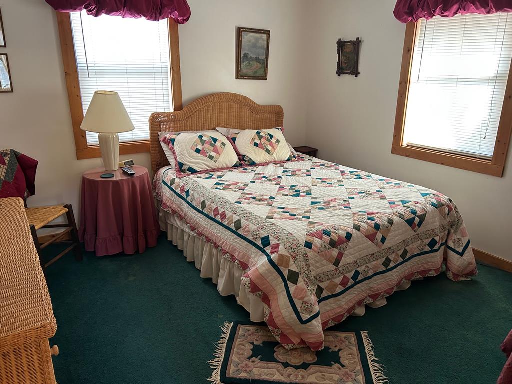 39 Thomas Ridge Lane Blairsville, GA 30512 - Photo 12 of 19 a bedroom with a bed chair and a window
