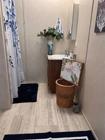 a living room with furniture and a chair