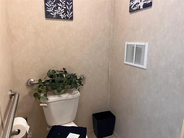 a bathroom with a toilet and a sink