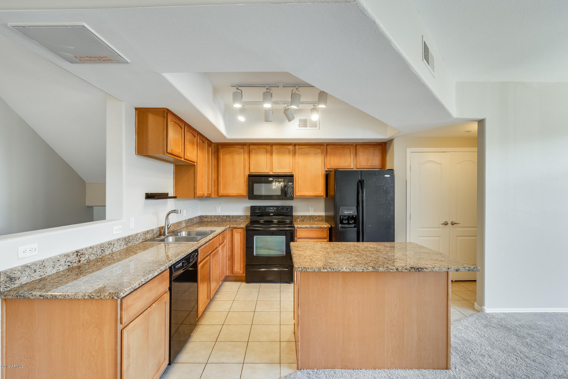 2401 East Rio Salado Parkway, Unit 1124 Tempe, AZ 85288 - Photo 2 of 32 a kitchen with stainless steel appliances granite countertop a sink and a counter top space