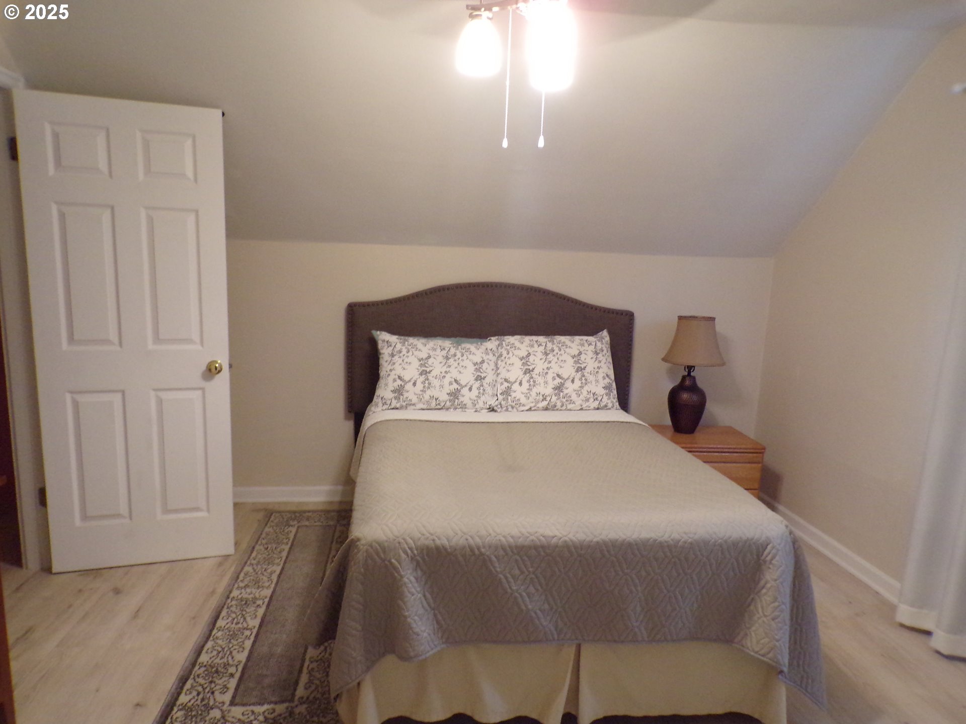 960 Shipping Street Northeast Salem, OR 97301 - Photo 17 of 29 a bed sitting in a bedroom next to a window