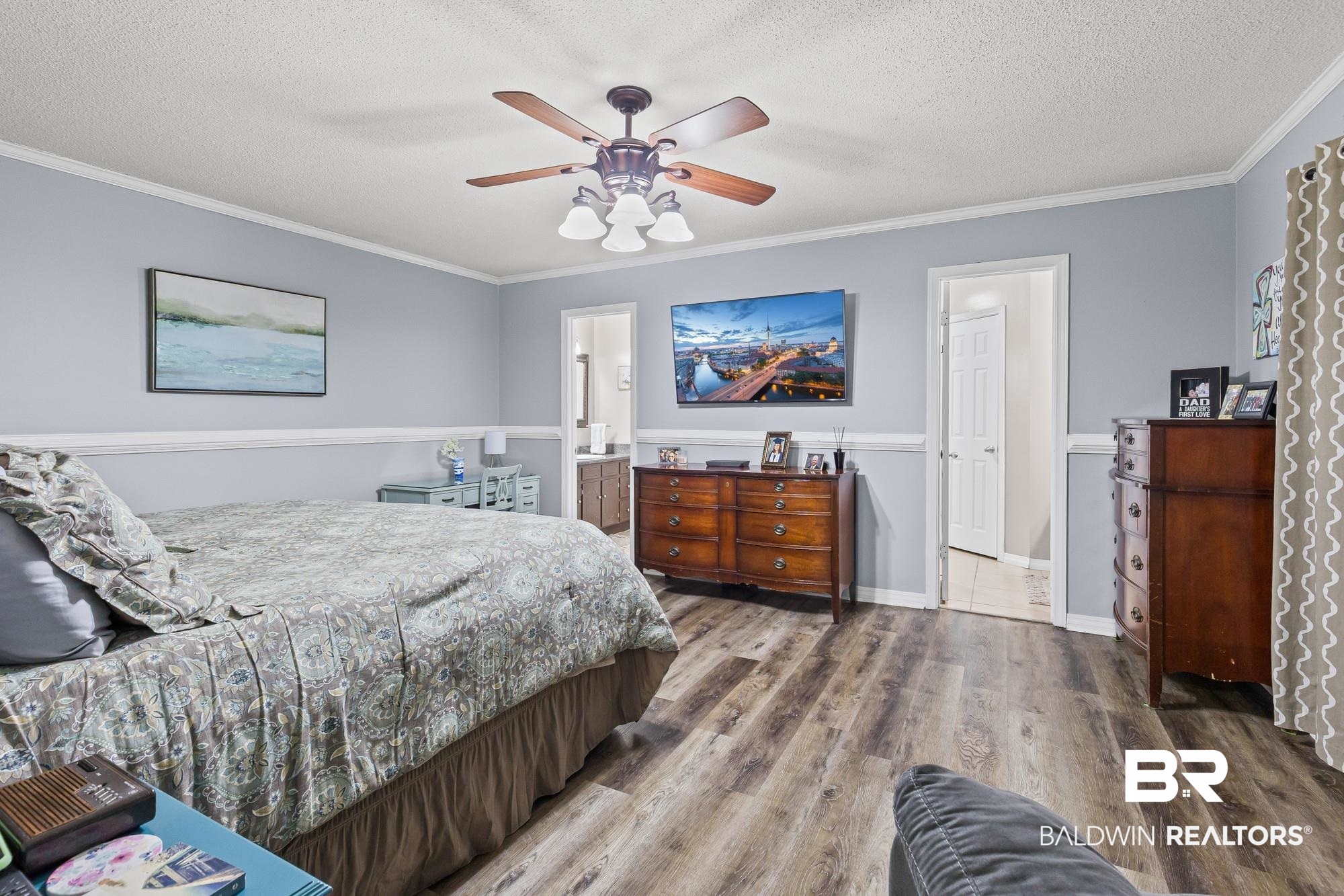 6609 Blakeley Court Mobile, AL 36695 - Photo 19 of 28 Bedroom featuring wood finished floors, ornamental molding, a textured ceiling, and a ceiling fan