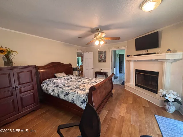 a room with a bed and a large window