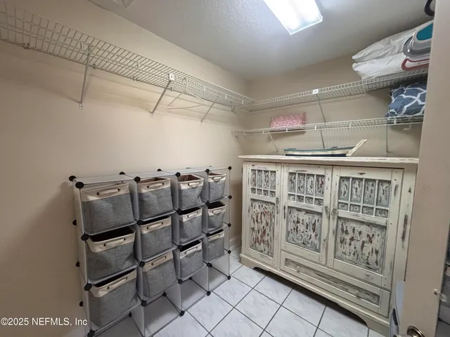 a living room with furniture and lamp