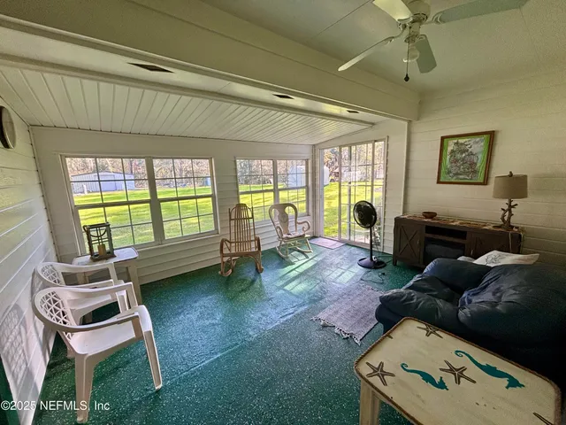 a outdoor living space with furniture and a rug