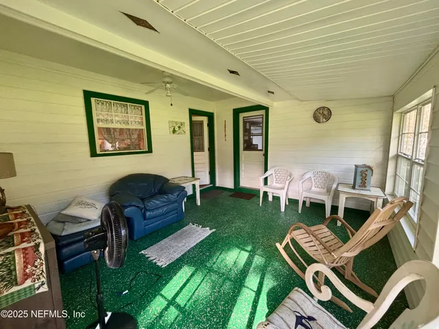 a view of swimming pool with an outdoor space and seating area