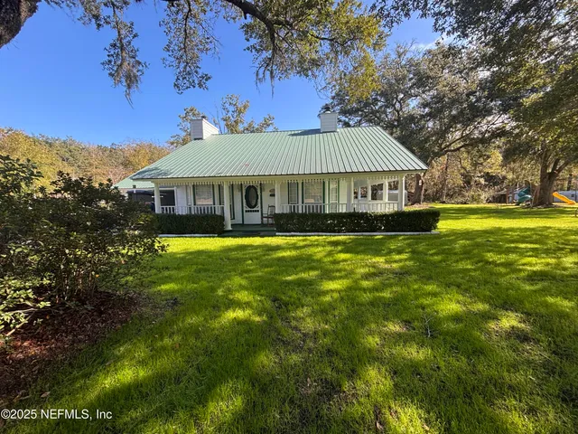 a view of a house with a big yard
