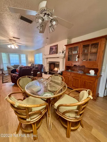 a living room with a fireplace and a fireplace